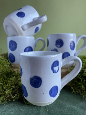 Painted porcelain pitcher and mugs