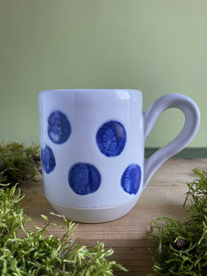 Painted porcelain pitcher and mugs